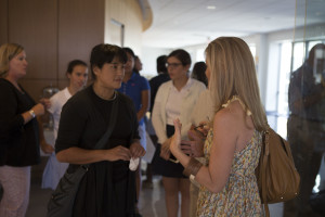 AN ARTISTIC PERSPECTIVE: Artist Colette Fu discusses her artwork at the campus center gallery reception on September 16. Photo courtesy of Jenna Cooley '16