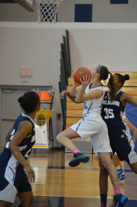 LIGHTNING FAST: Furey seizes a narrow opportunity to take a shot. Photo courtesy of Maggie Mengel '17