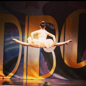 WEIGHTLESS: Emma Kelly '17 flawlessly executes a straddle jump at the Starbound Dance Competition.  . Photo courtesy of On Edge Movement Dance