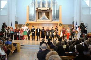 SCROOGE CHAPEL: The Scrooge Chapel cast stands on the stage after performing the skit. The Scrooge Chapel is an annual event and tradition that the members of the EA community participate in, either as actors or audience members. Photo Courtesy of Michael Leslie