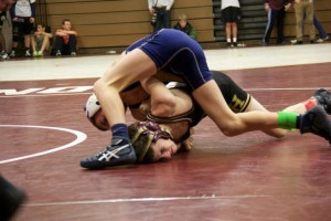 ON TOP: Blair Orr '18 takes his opponent to the ground for a point. Photo courtesy of  EA Wrestling Team 