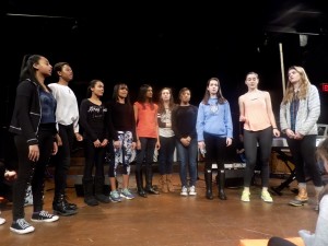 VOICES LOUD AND CLEAR: Bella Voce performs in the black-box theatre with Kelly Flynn '17 and Helena Bryant '17 leading the group.  Photo Courtesy of Nellie Konopka ‘16. 