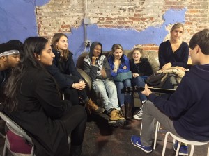 BUILDING BRIDGES: The fall Cross Bridge group  listens to Jack Franklin '19 play guitar at the Poetry Workshop in Philly. Photo Courtesy of Jenna Cooley '16