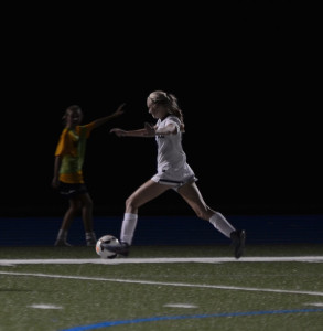 MAKING MOVES: Julia Depillis ‘18, Co-Captain of EA Girls’ Varsity Soccer, executes a play in an under-the-lights game against Germantown Academy. Photo Courtesy of: Alex Conroy ‘19