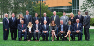 DEDICATION: The board of trustees pose together on the green.  Photo Courtesy of EpiscopalAcademy.org